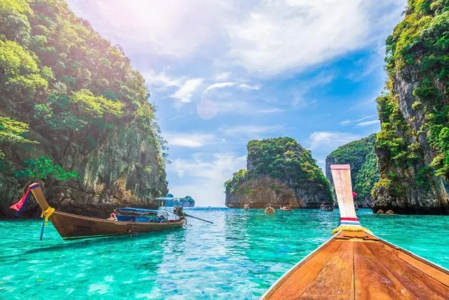 Longtail boats in turquoise water
